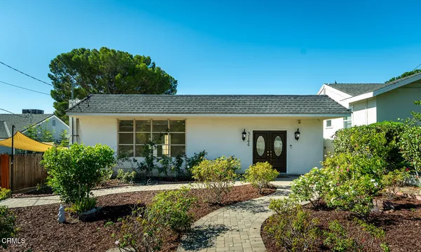 front view of a house with a yard