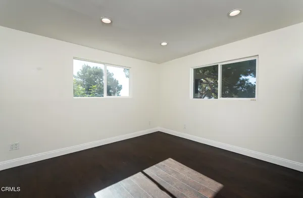 a bathroom with a sink vanity and a mirror