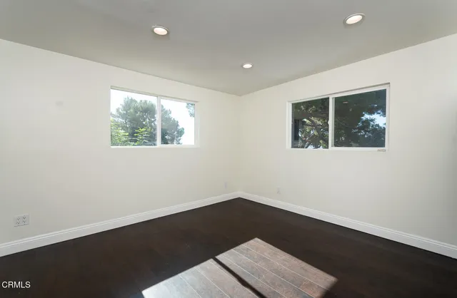 a bathroom with a sink vanity and a mirror