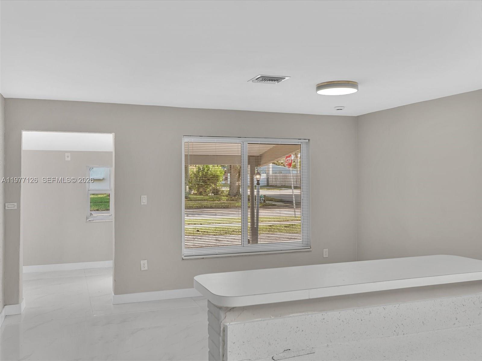 6800 Raleigh Street Hollywood, FL 33024 - Photo 11 of 42 an empty room with windows