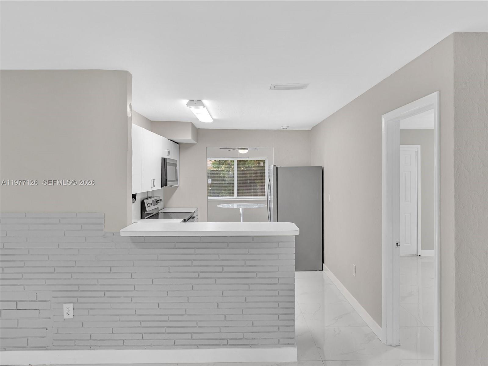 6800 Raleigh Street Hollywood, FL 33024 - Photo 14 of 42 a view of living room with furniture and window