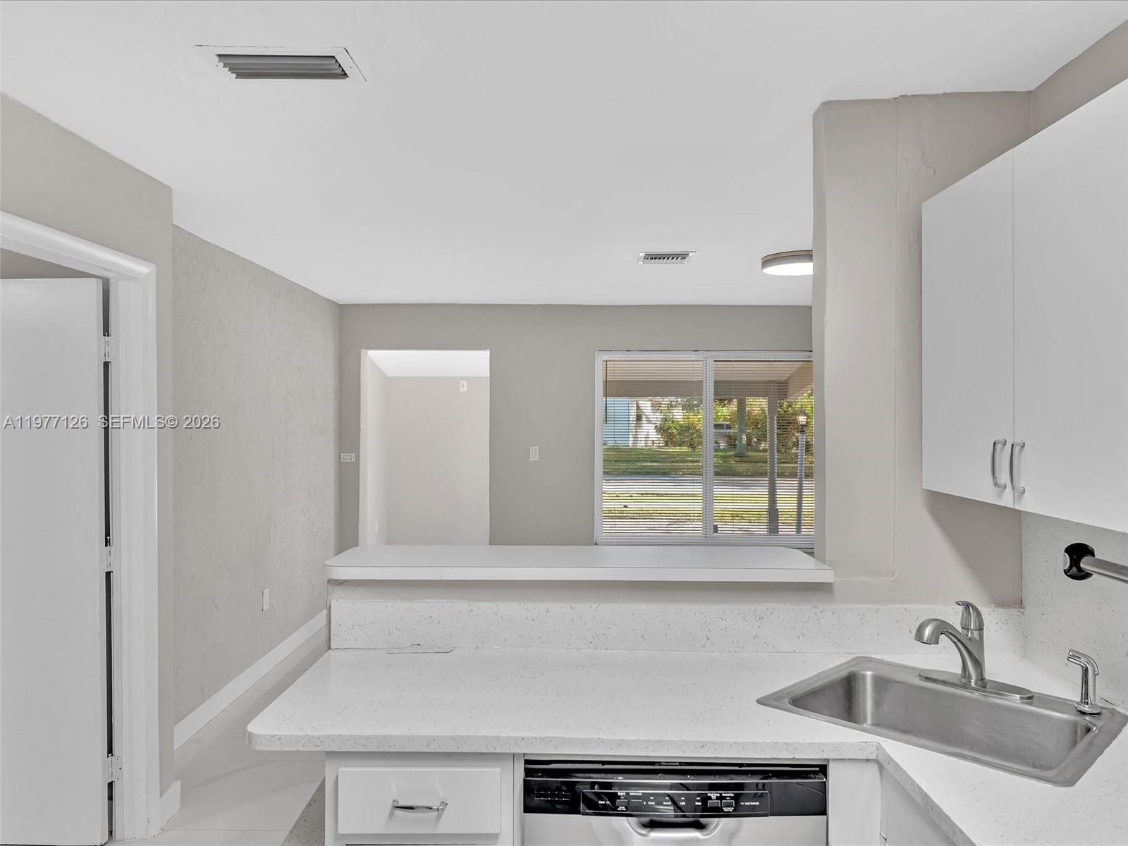 6800 Raleigh Street Hollywood, FL 33024 - Photo 16 of 42 a bathroom with a sink and a window