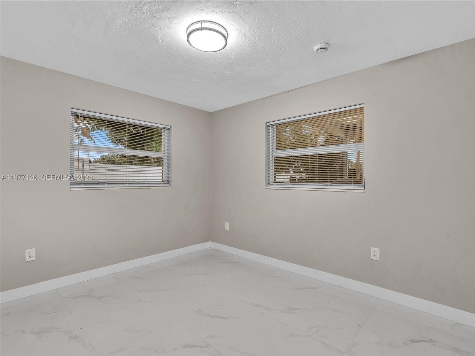 6800 Raleigh Street Hollywood, FL 33024 - Photo 26 of 42 a view of an empty room with a window