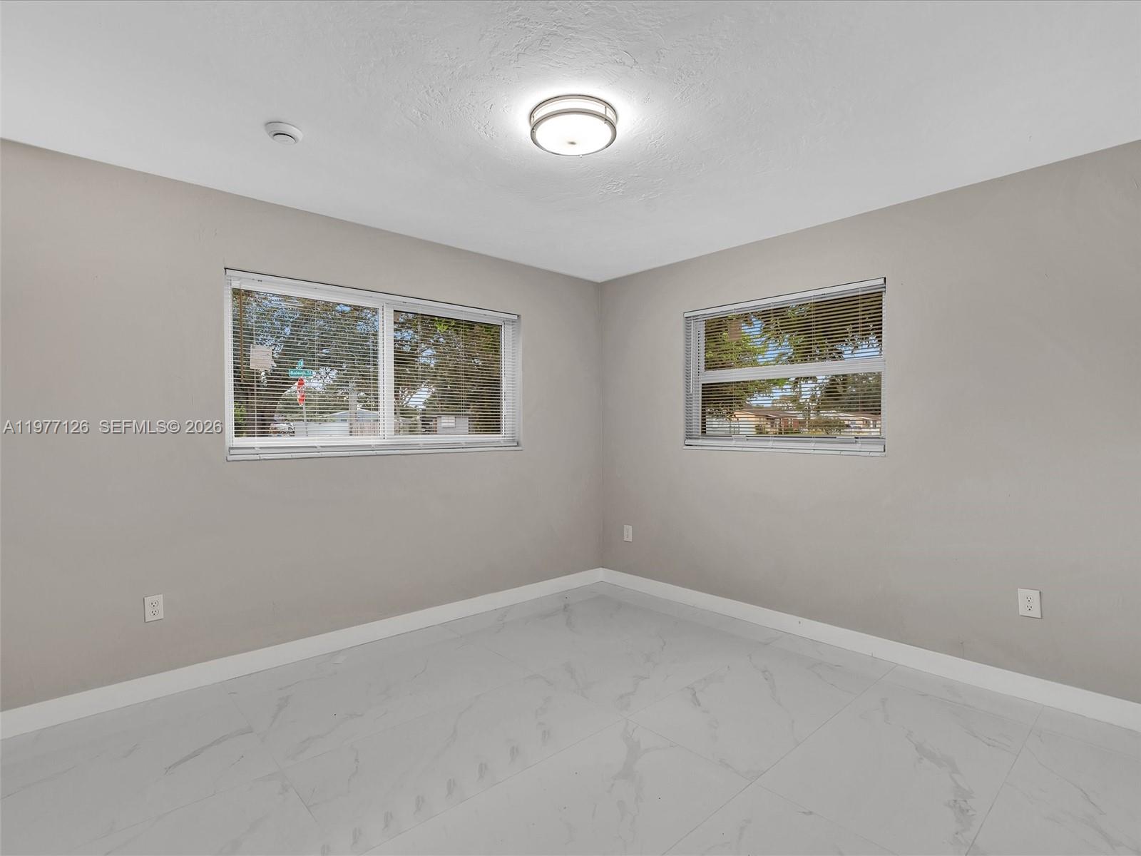 6800 Raleigh Street Hollywood, FL 33024 - Photo 29 of 42 a view of an empty room with a window