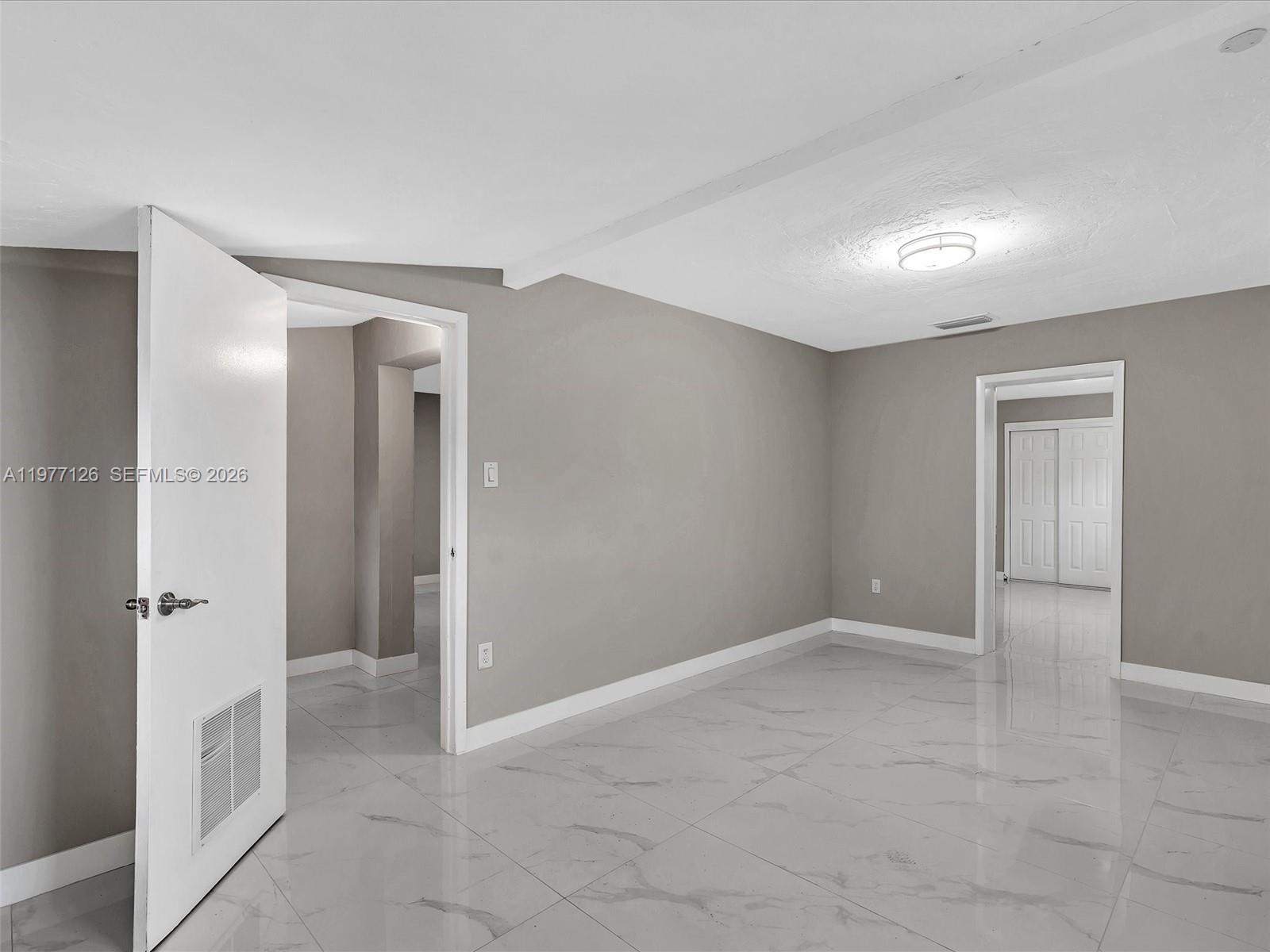 6800 Raleigh Street Hollywood, FL 33024 - Photo 31 of 42 wooden floor in an empty room