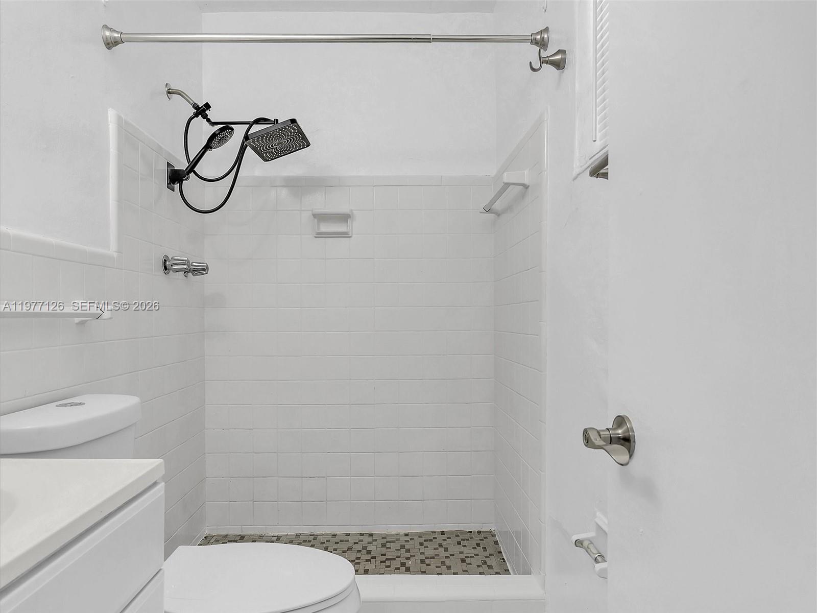 6800 Raleigh Street Hollywood, FL 33024 - Photo 34 of 42 a bathroom with a toilet and a shower