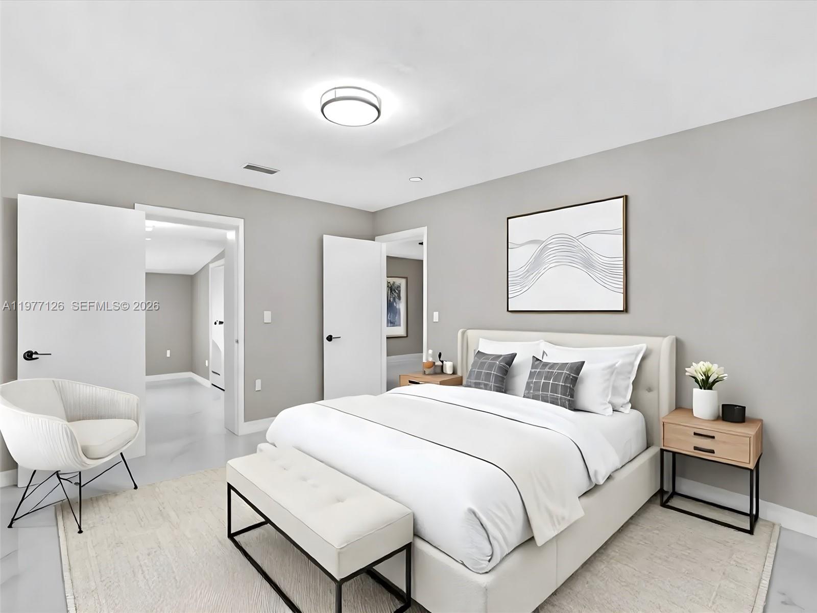 6800 Raleigh Street Hollywood, FL 33024 - Photo 36 of 42 a bedroom with a bed and a couch