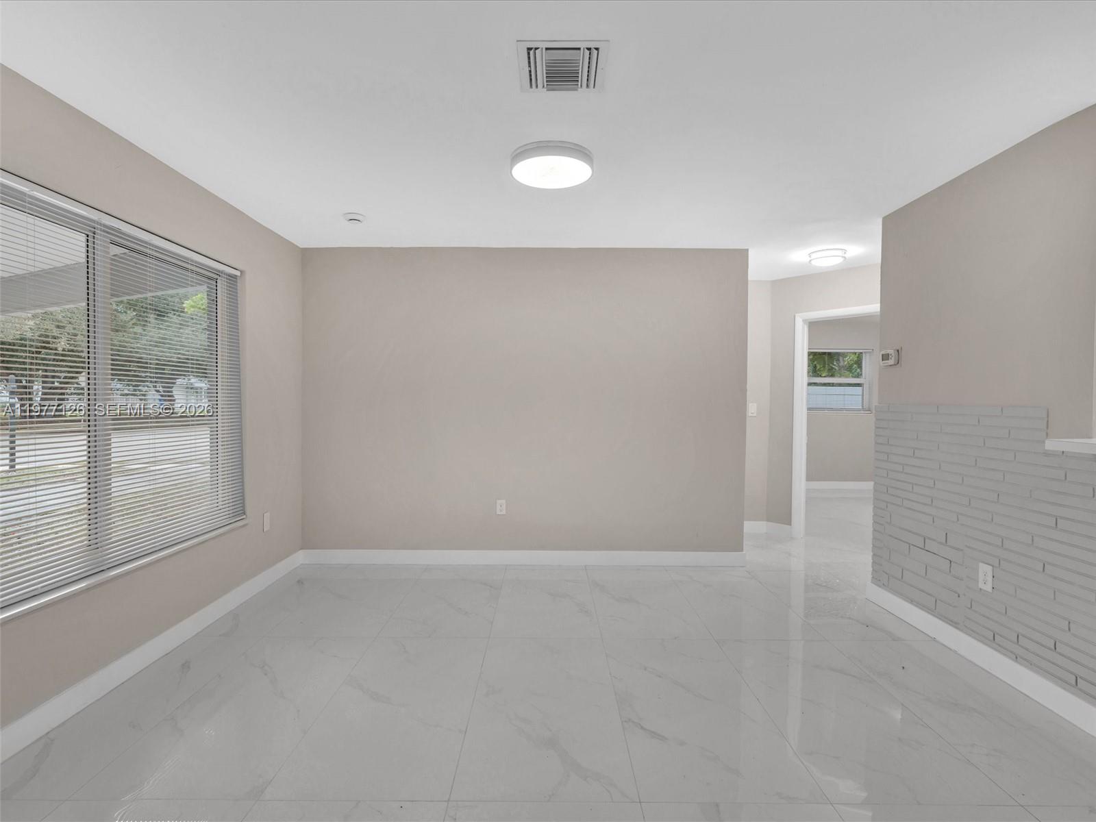 6800 Raleigh Street Hollywood, FL 33024 - Photo 8 of 42 a view of an empty room with a window