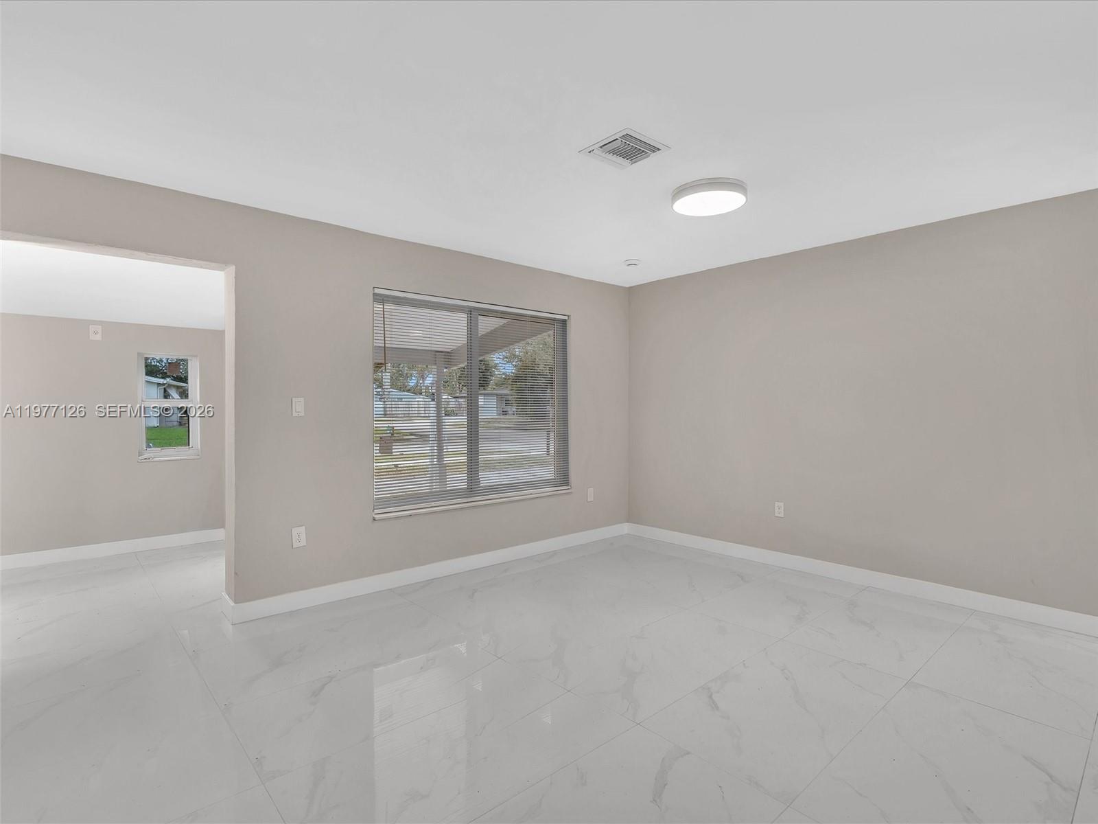 6800 Raleigh Street Hollywood, FL 33024 - Photo 10 of 42 an empty room with windows and closet