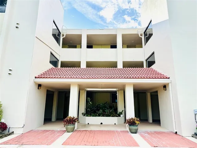 a view of a chairs and tables on the grass