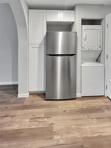 a view of a room with wooden floor and closet