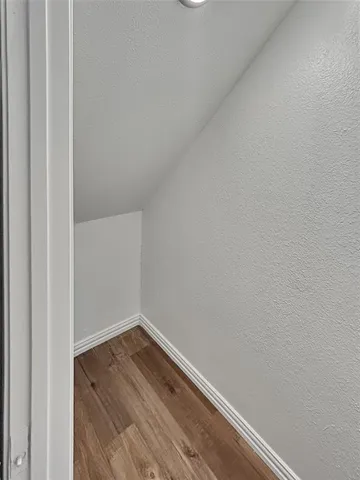 a view of a small space with wooden floor