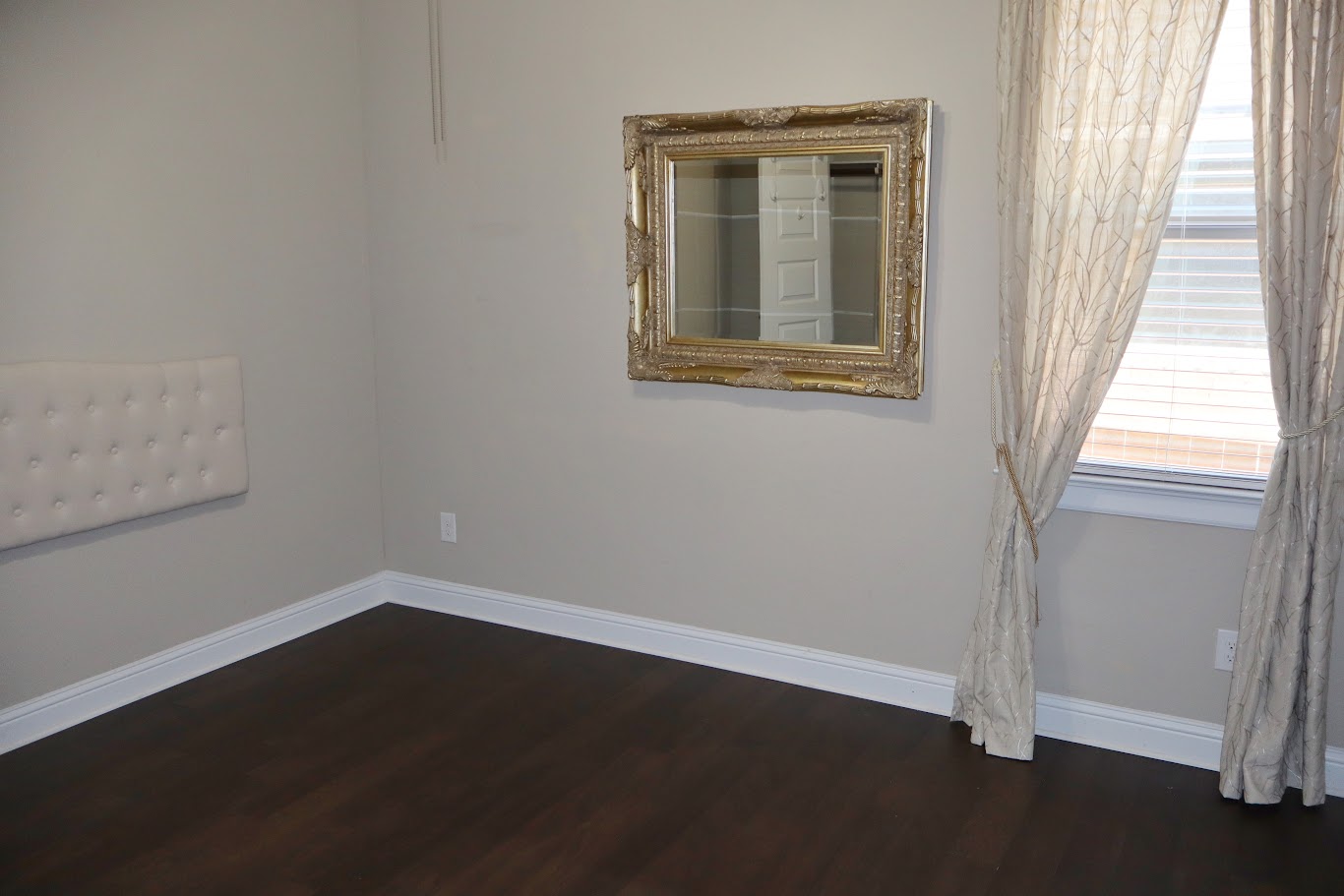 1509 Highland Ridge Road Georgetown, TX 78628 - Photo 13 of 28 Rich hardwood flooring complements a bedroom offering ample natural light and clean lines.