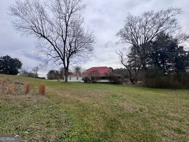 4600 Mahan Road Summerville, GA 30747 - Photo 3 of 18 a view of a garden with large trees