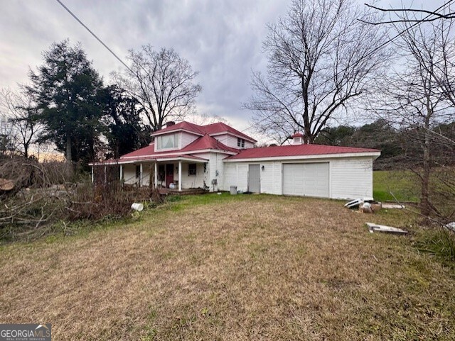 4600 Mahan Road Summerville, GA 30747 - Photo 4 of 18 a front view of a house with a yard and garage