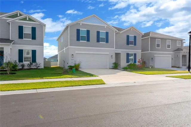 a view of house with a swimming pool