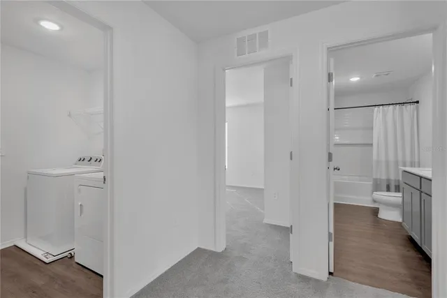 a utility room with dryer and washer