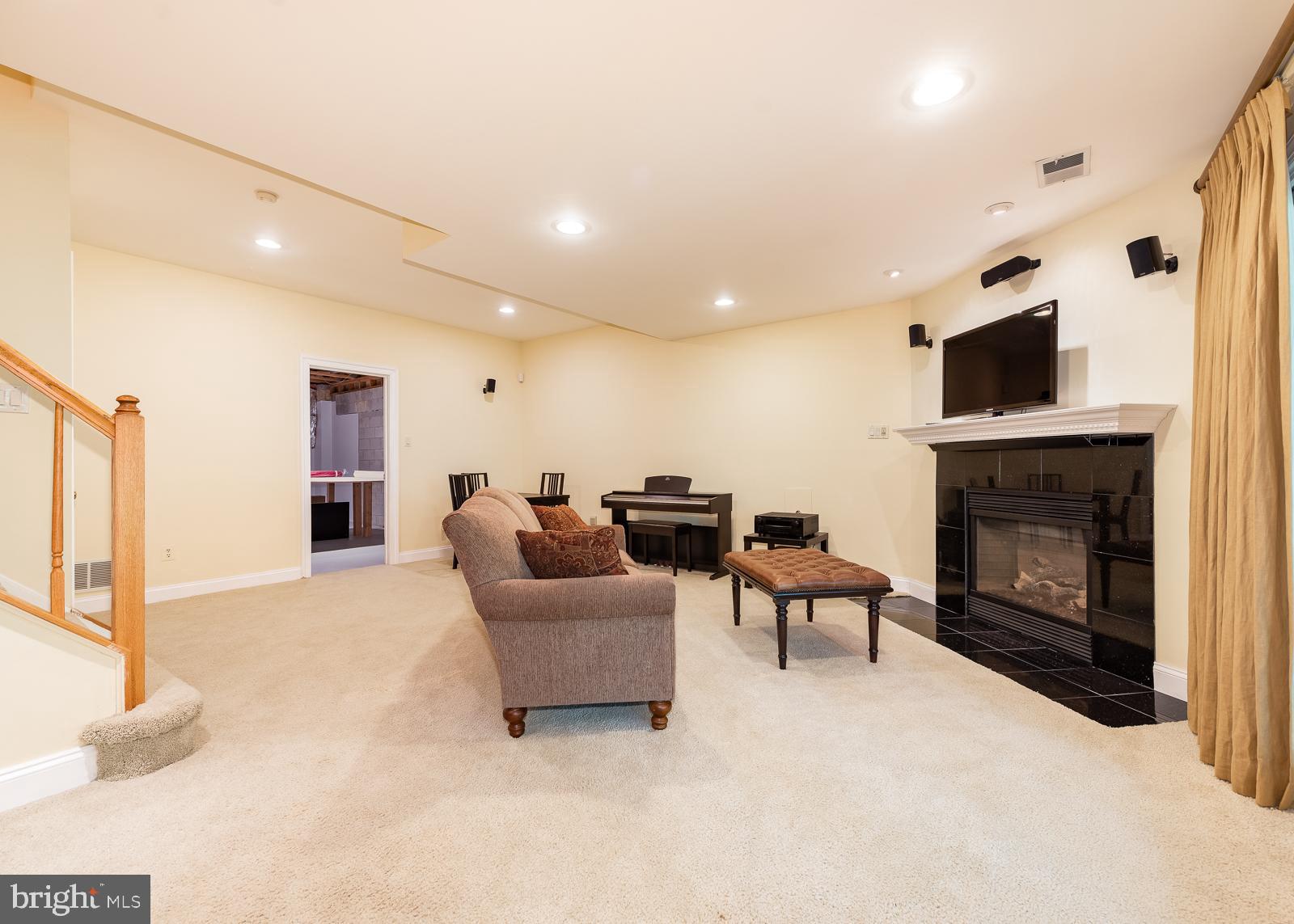 5235 Columbia Road, Unit 568 Columbia, MD 21044 - Photo 31 of 45 Elegant basement with gas fireplace