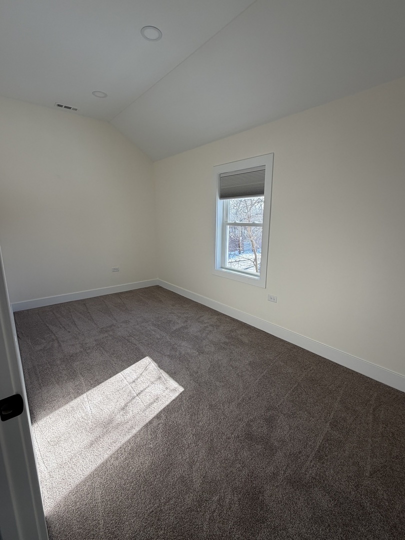 915 South Spencer Road, Unit 2 New Lenox, IL 60451 - Photo 4 of 10 an empty room with windows