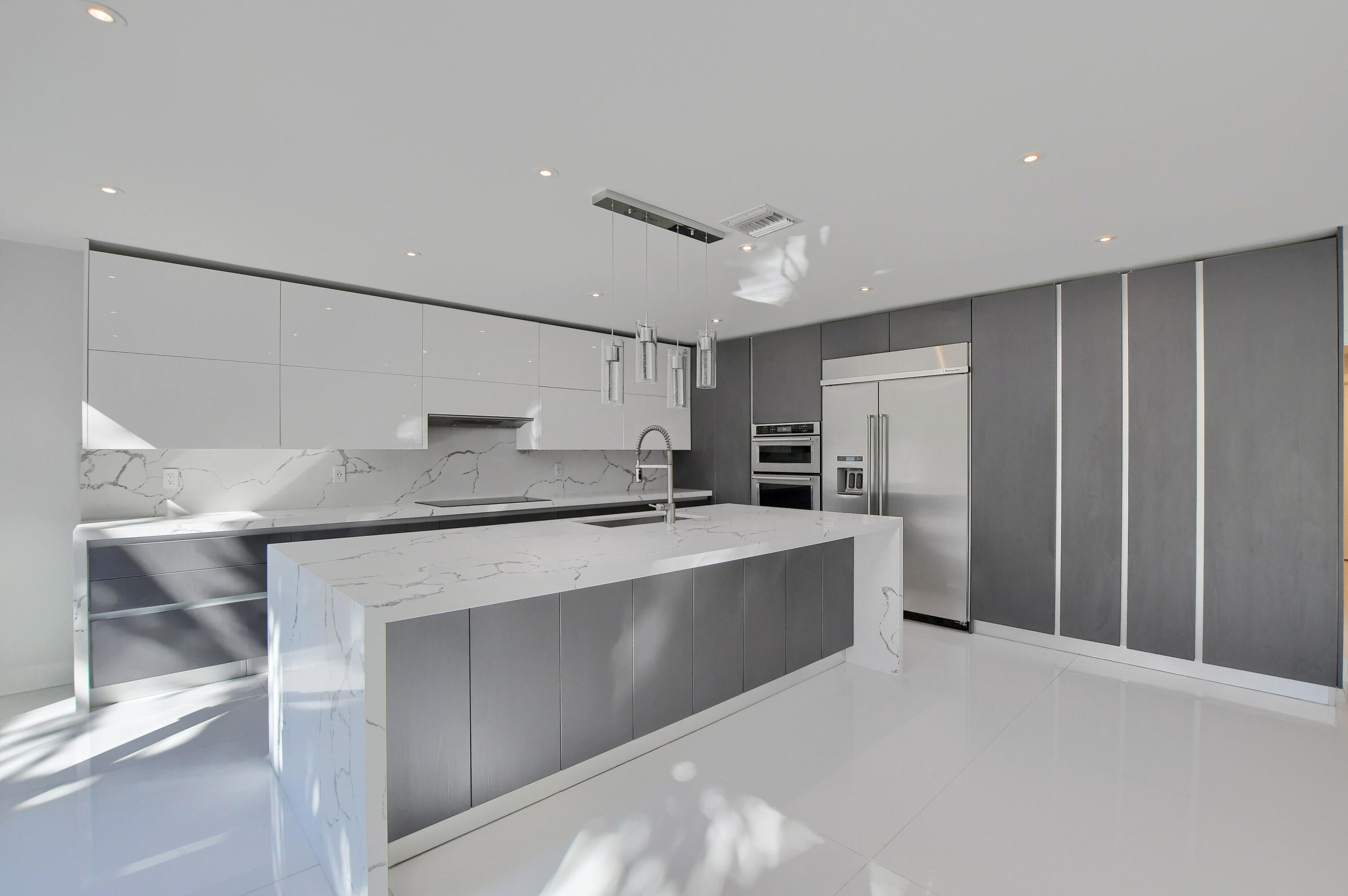 23352 Lago Mar Circle Boca Raton, FL 33433 - Photo 14 of 78 a kitchen with stainless steel appliances a refrigerator and a sink