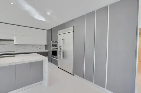 a view of wooden floor and windows in an empty room