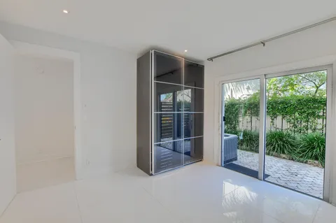 a view of a room with wooden floor and stairs