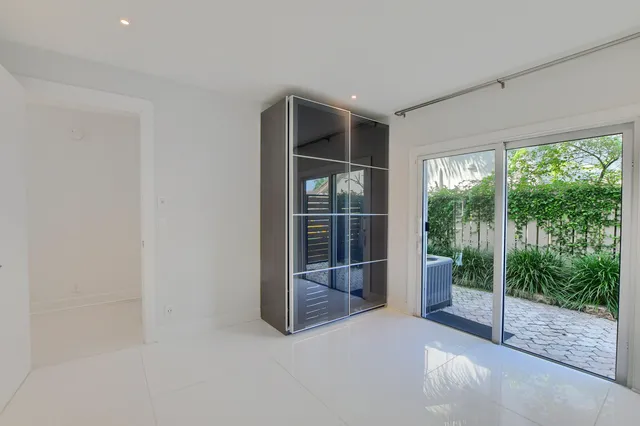 a view of a room with wooden floor and stairs