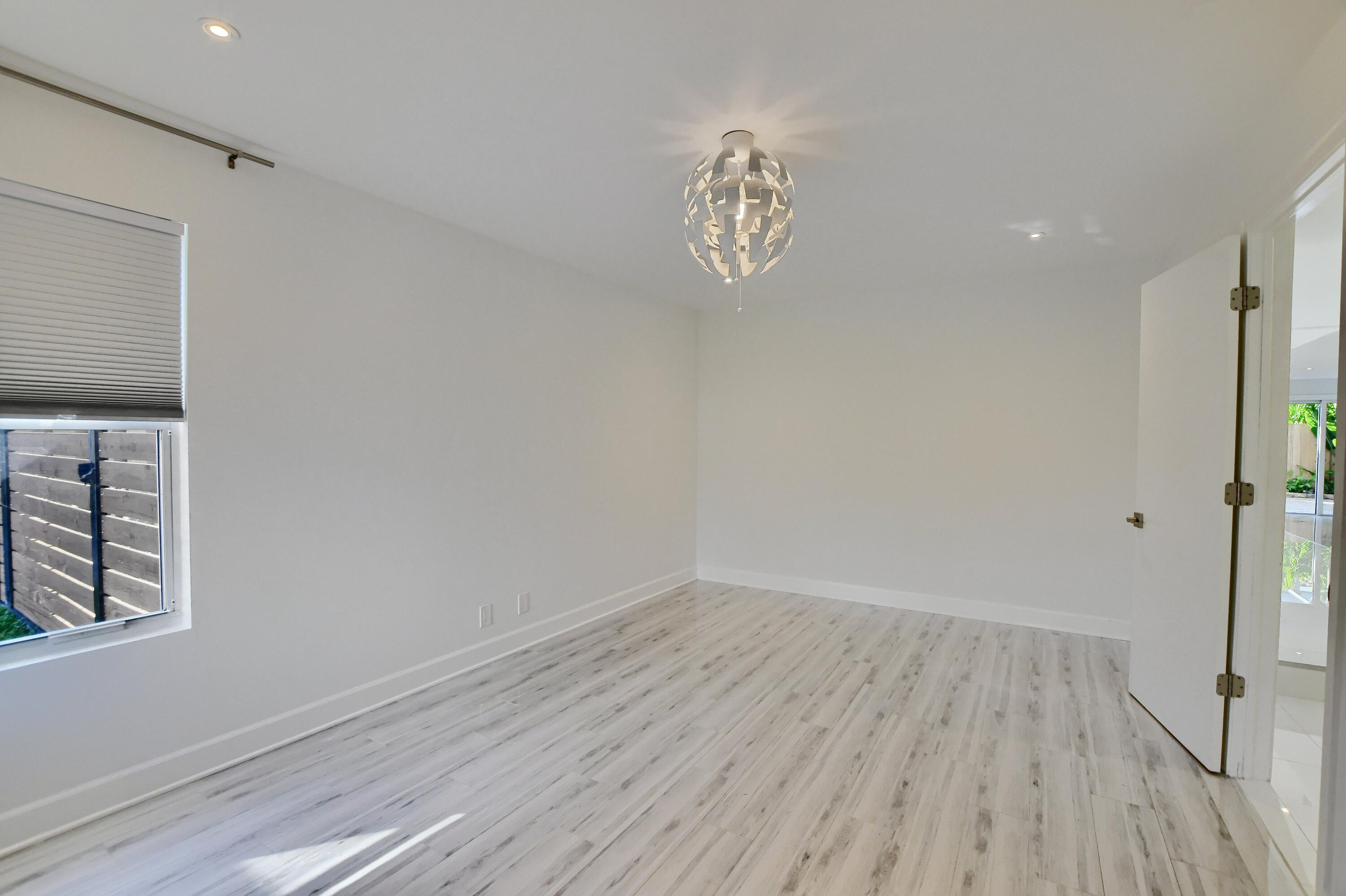 23352 Lago Mar Circle Boca Raton, FL 33433 - Photo 29 of 78 a view of a room with wooden floor and window