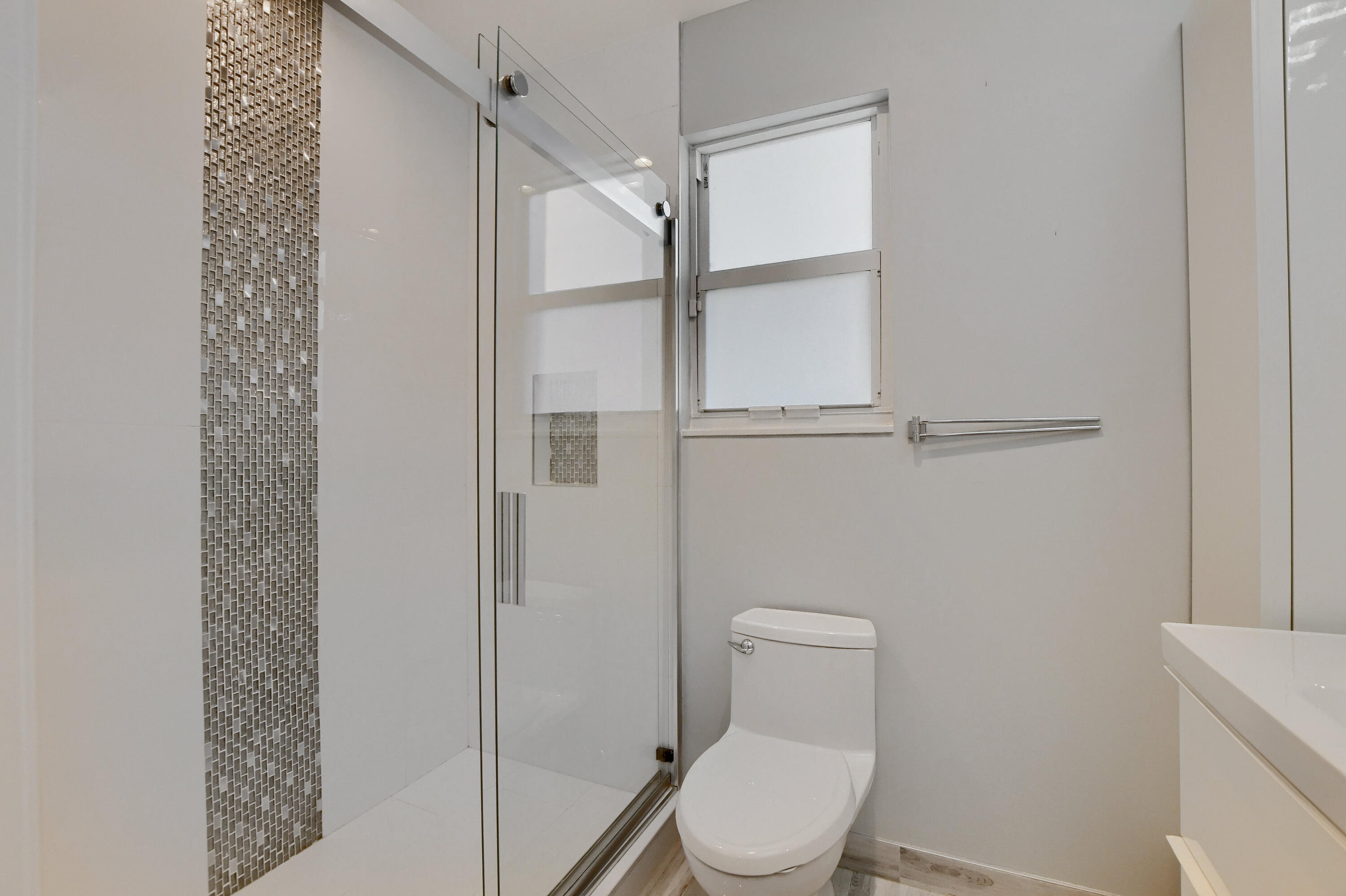 23352 Lago Mar Circle Boca Raton, FL 33433 - Photo 33 of 78 a white toilet sitting next to a shower