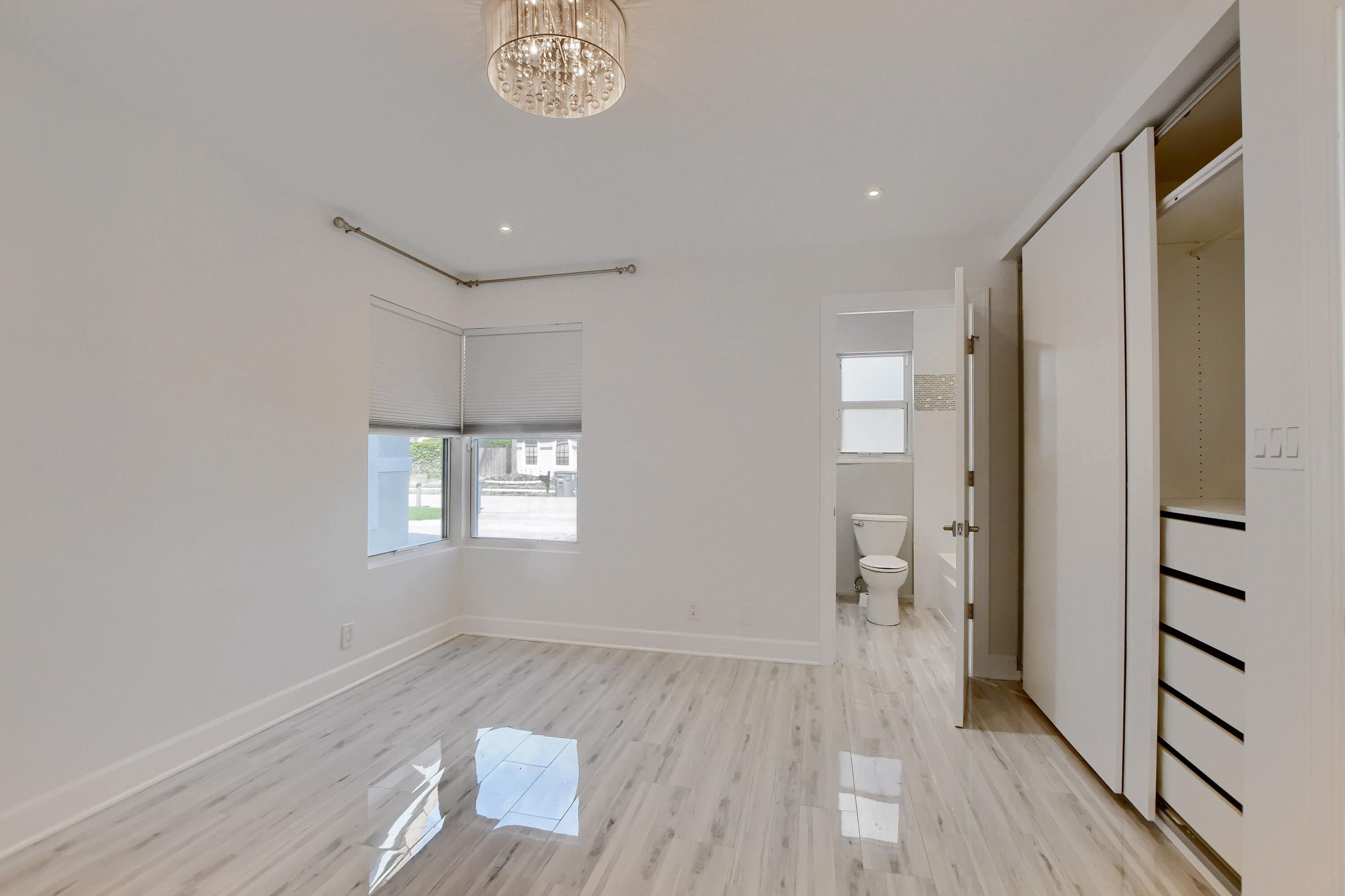 23352 Lago Mar Circle Boca Raton, FL 33433 - Photo 34 of 78 a view of wooden floor and windows in an empty room