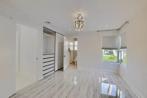 a bathroom with a tub and a window