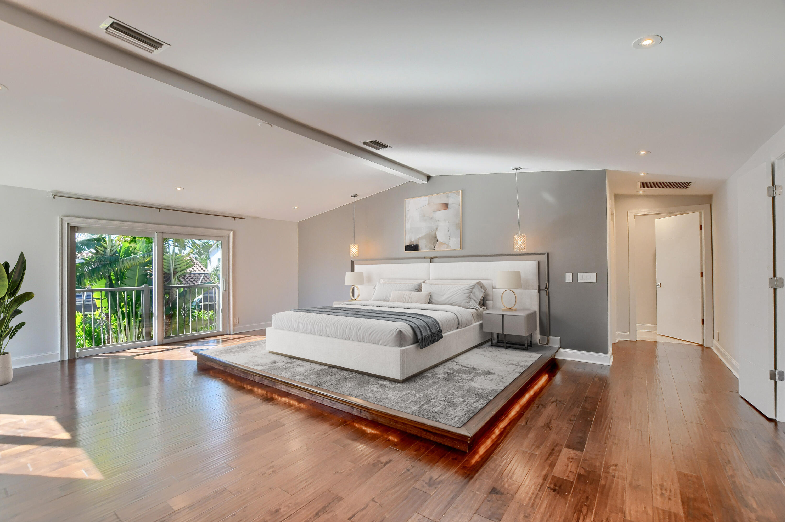 23352 Lago Mar Circle Boca Raton, FL 33433 - Photo 50 of 78 a spacious bedroom with a bed a table and a large window