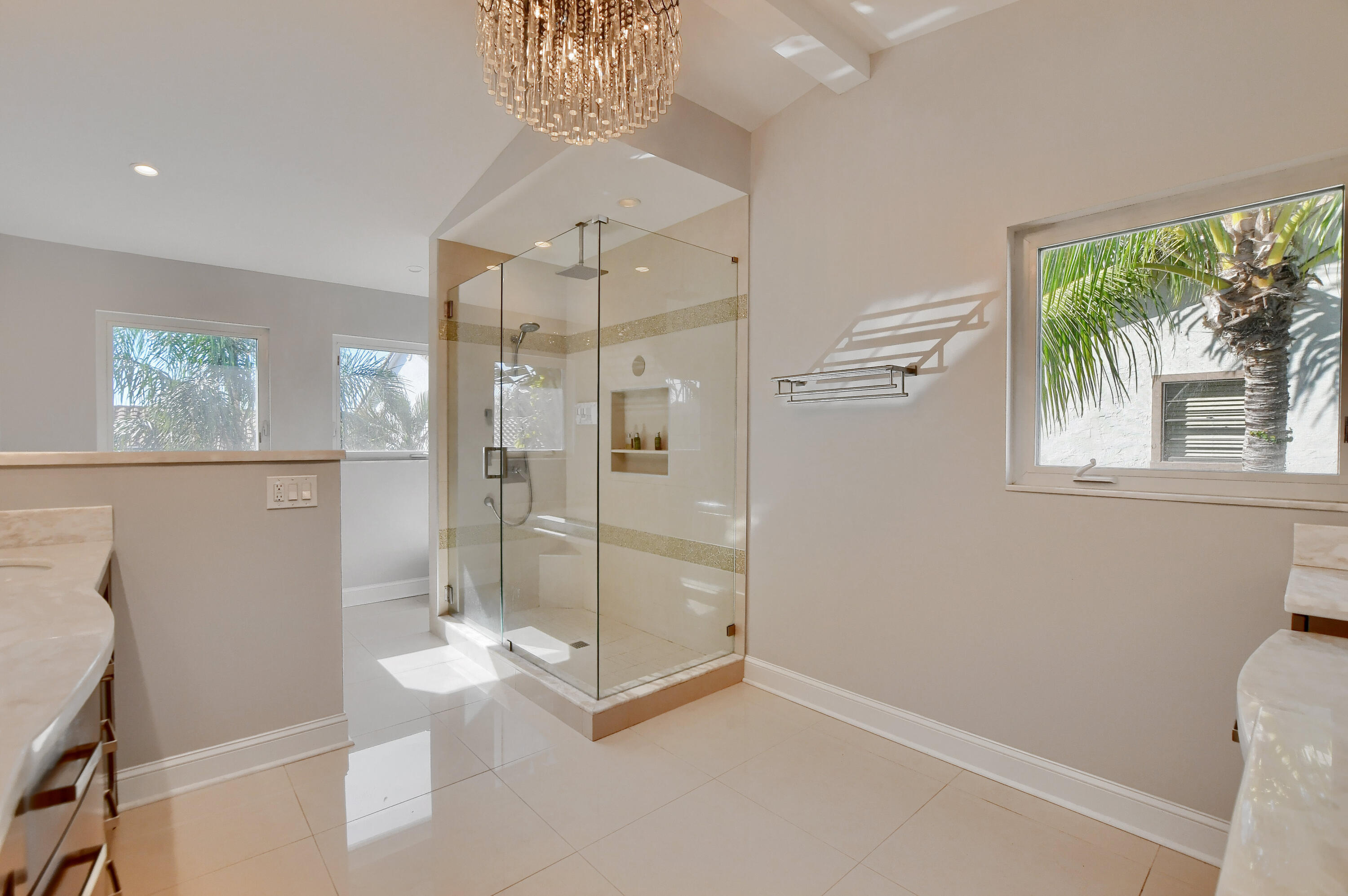 23352 Lago Mar Circle Boca Raton, FL 33433 - Photo 56 of 78 a bathroom with a glass shower door and a toilet