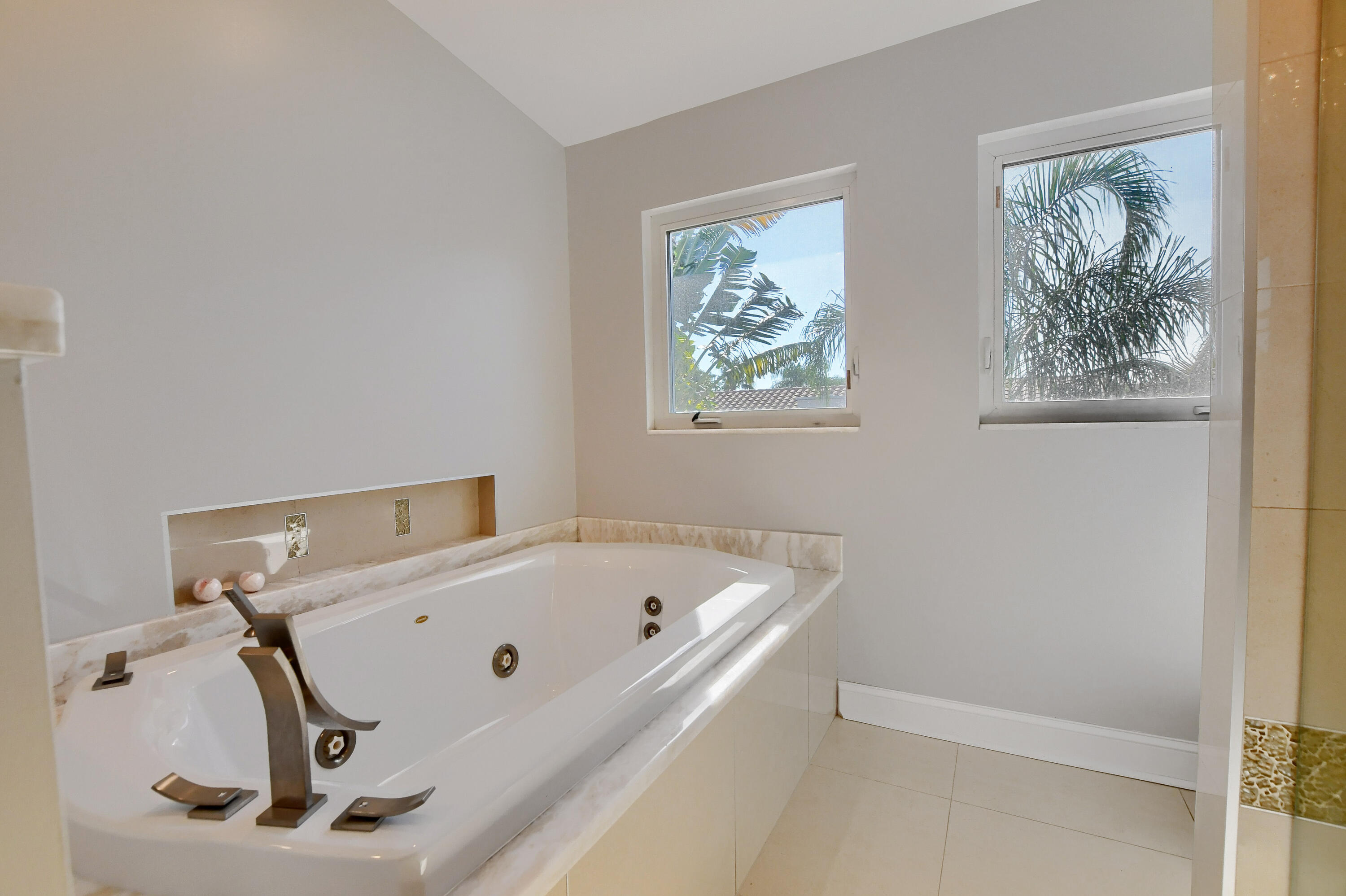 23352 Lago Mar Circle Boca Raton, FL 33433 - Photo 58 of 78 a bathroom with a tub and a window