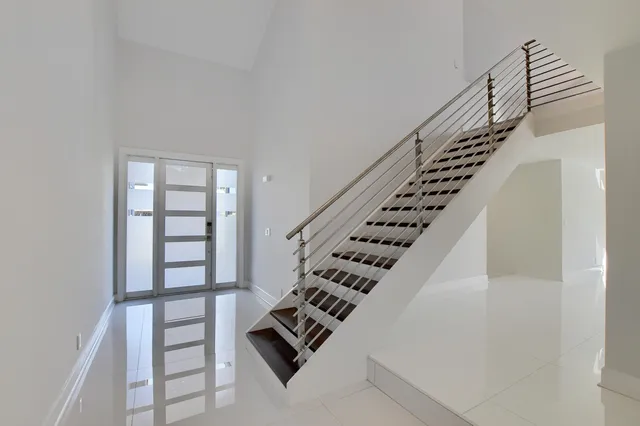 a kitchen with stainless steel appliances a refrigerator and a sink