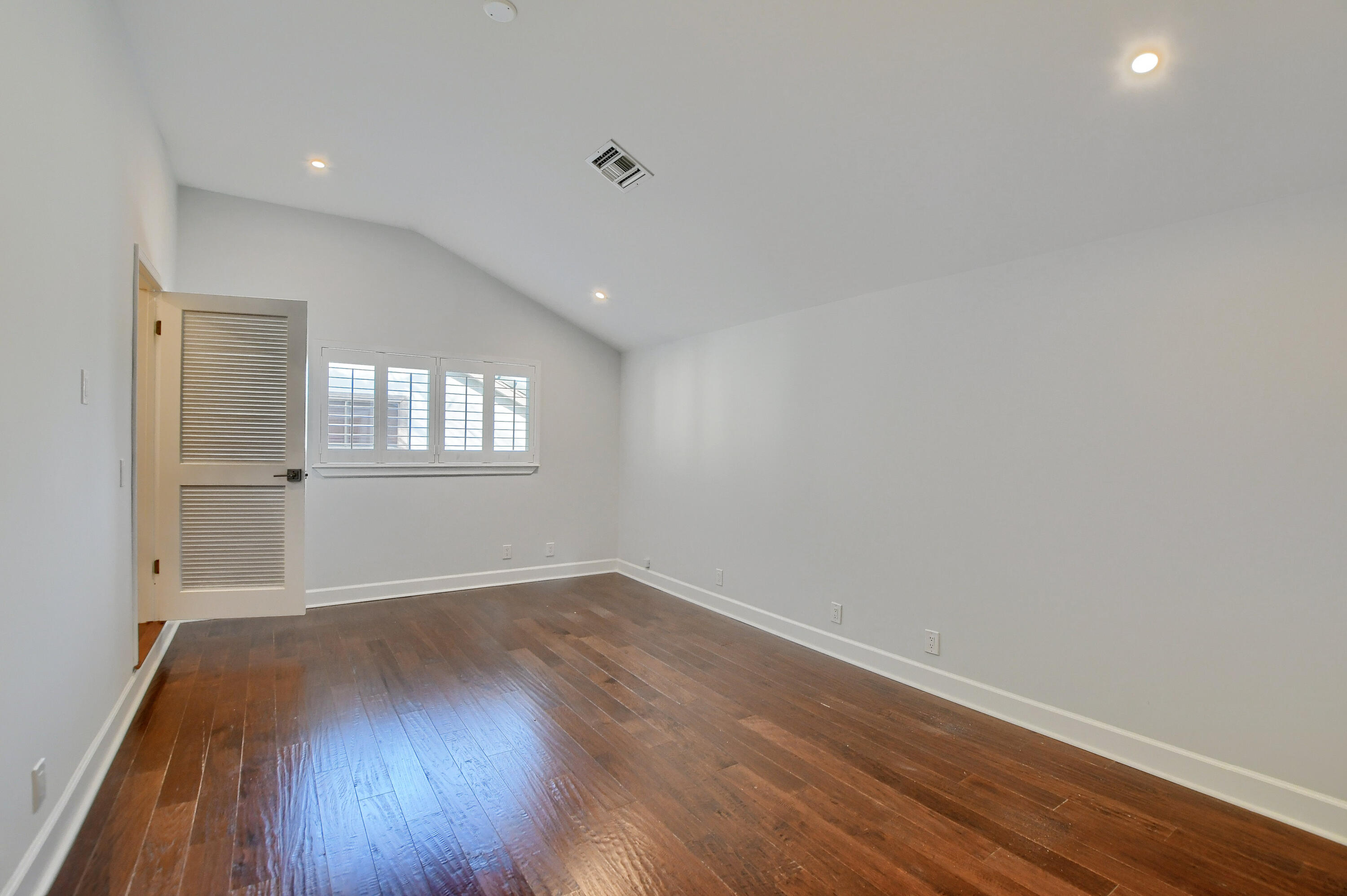 23352 Lago Mar Circle Boca Raton, FL 33433 - Photo 61 of 78 an empty room with wooden floor and windows