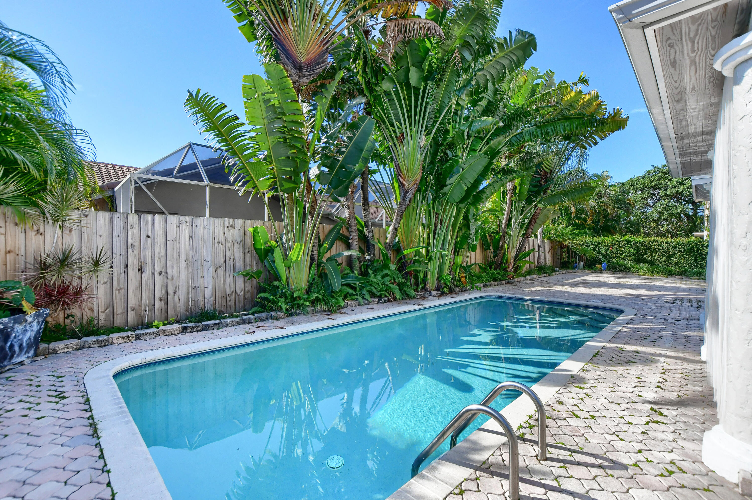 23352 Lago Mar Circle Boca Raton, FL 33433 - Photo 72 of 78 a view of a backyard with a small pool