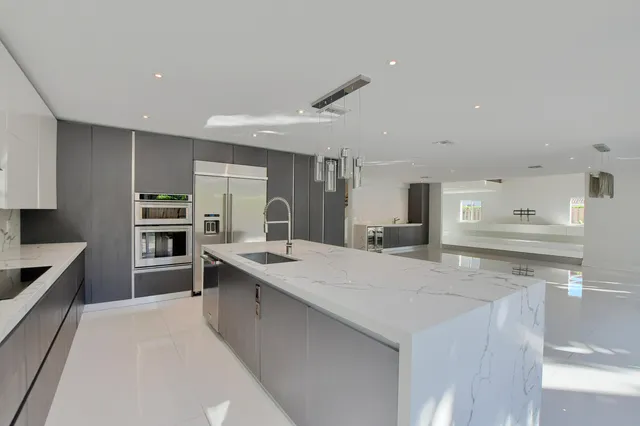 a kitchen with a sink and cabinets