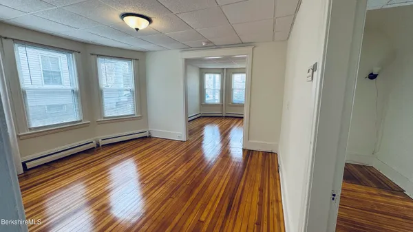 a view of front door with wooden floor