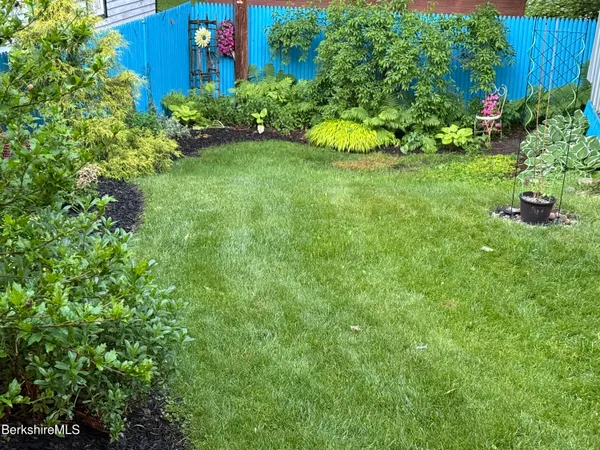 a view of a garden with a building