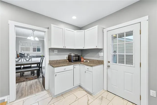 a utility room with sink dryer and washer