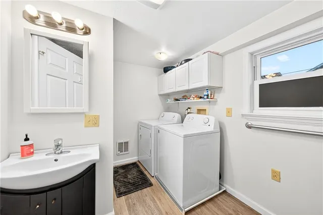 a bedroom with a bed next to a window