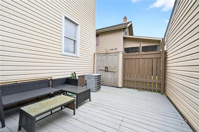 a view of a white house with a yard