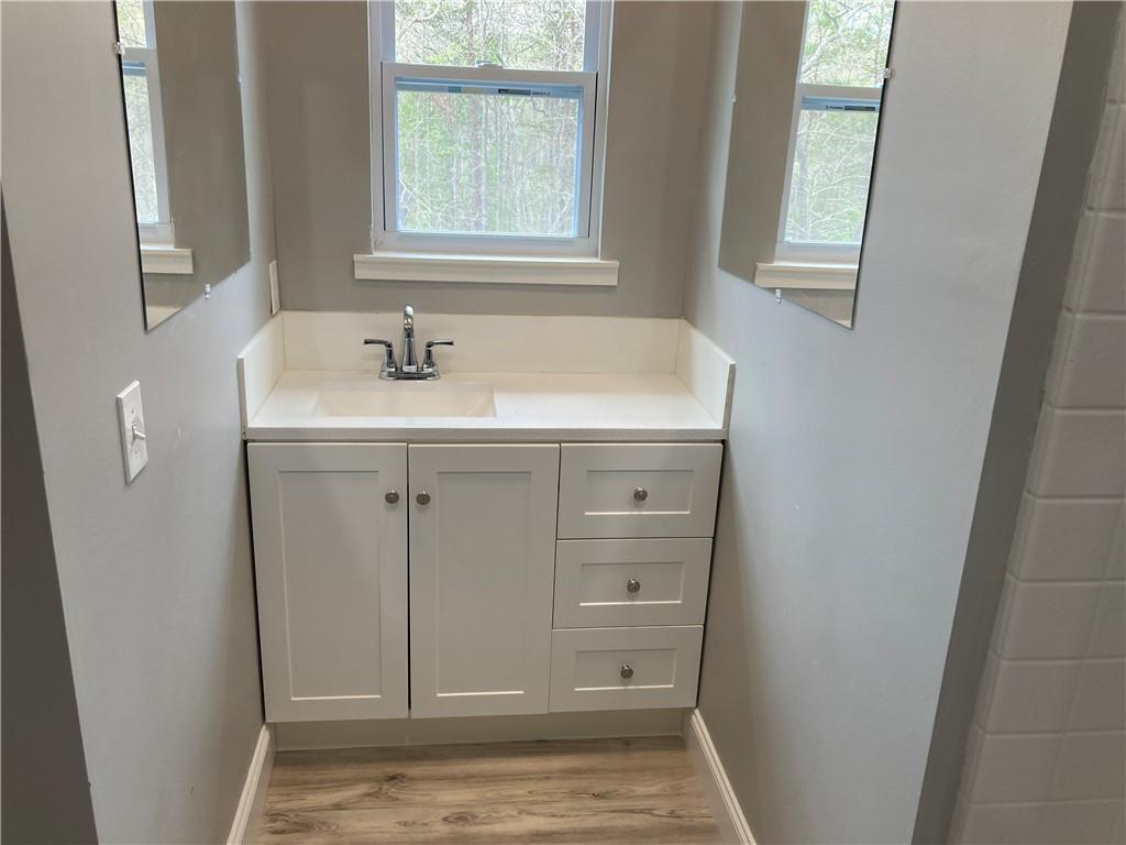 100 A Dickerson Road Dahlonega, GA 30533 - Photo 11 of 15 a bathroom with a sink and a mirror