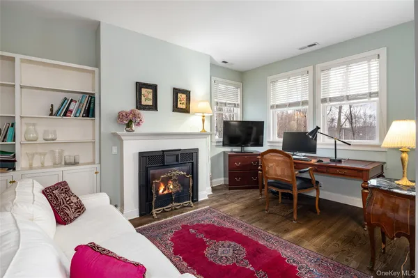 a bedroom with a bed and a fireplace