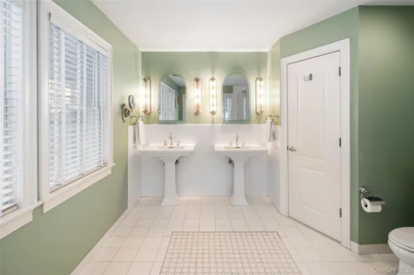 a spacious bathroom with shower bathtub and window