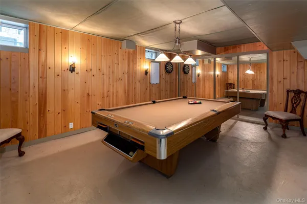 a front view of residential houses with yard and trees