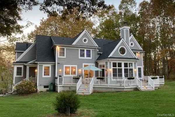a view of a house with a yard porch and sitting area