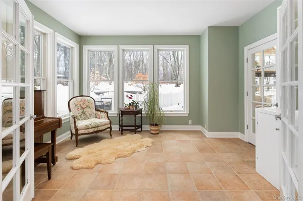 a view of a livingroom with furniture and windows