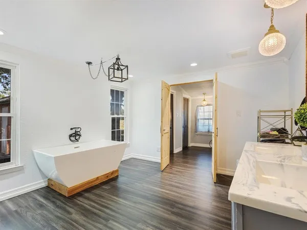 a spacious bathroom with a double vanity sink and a mirror